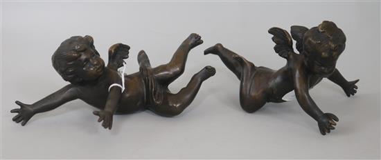 A pair of bronze cherubs